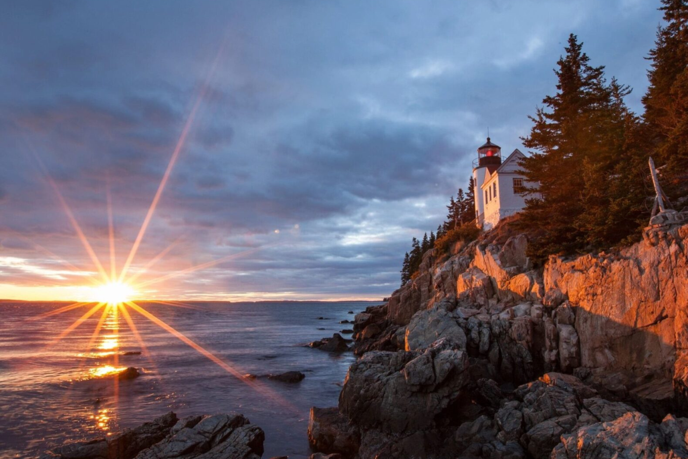 A lighthouse on the shore of a body of water